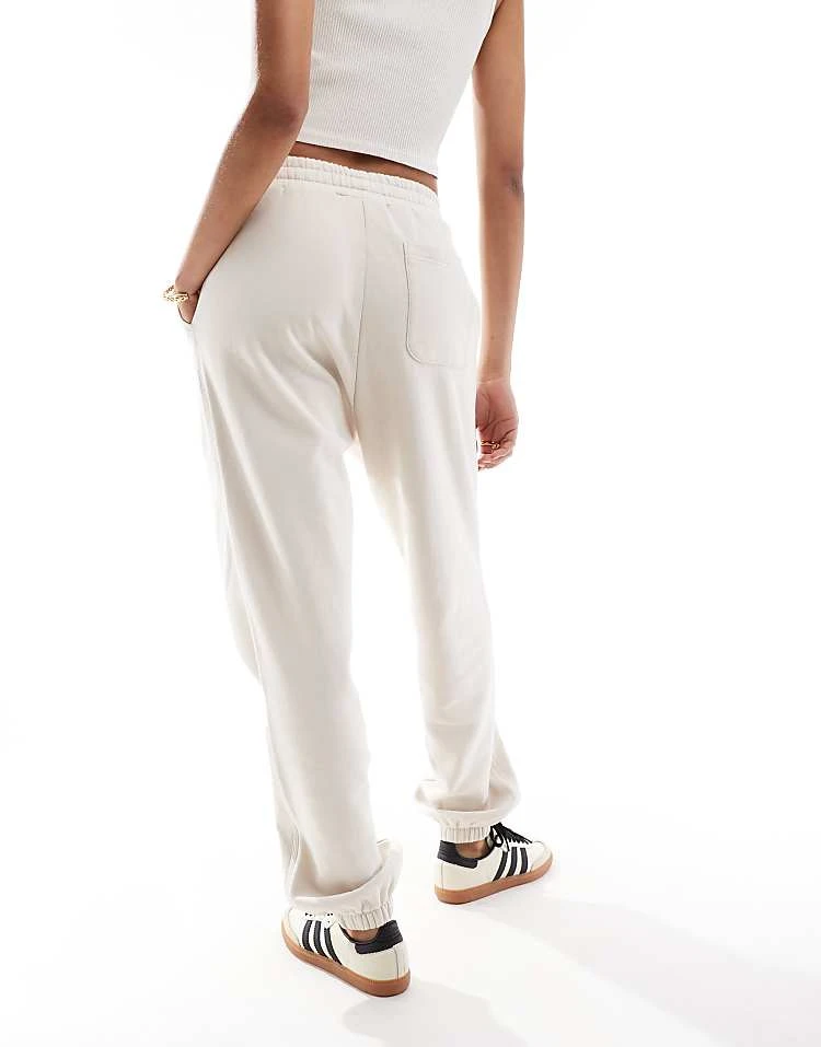 Carhartt WIP Co-ord American Script Joggers In Cream For Women 2 Carhartt WIP Co-ord American Script Joggers In Cream For Women - Image 2